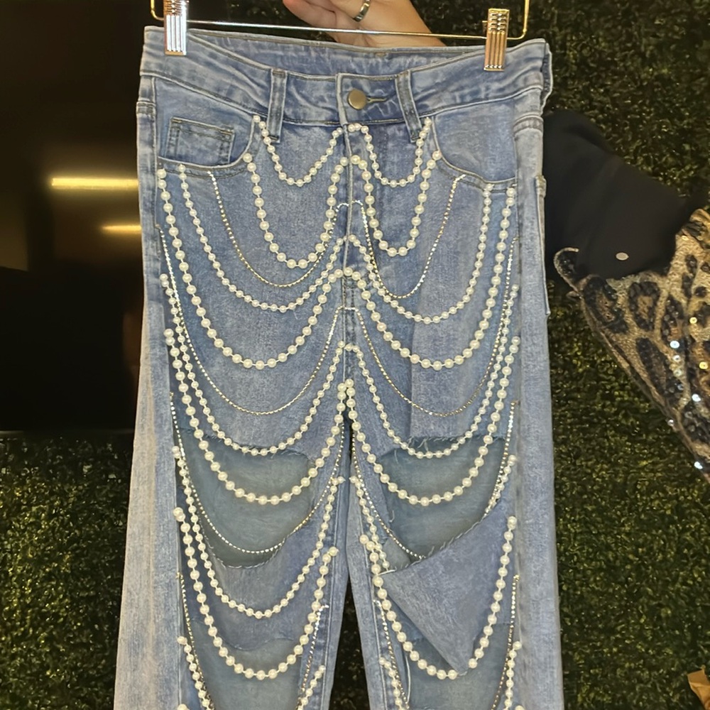 Jeans with adorable pearl, sparkle, and rip details!